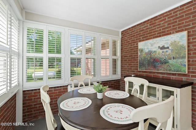 26122 Sheared Stokes Rd, Hilliard, FL 32046 - dining room featuring brick wall
