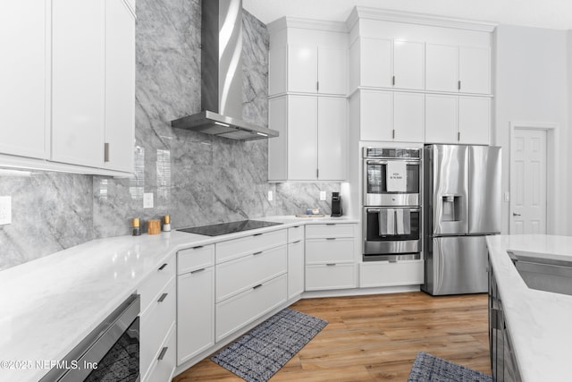1317 Garrison Dr, Saint Augustine, FL 32092 - kitchen featuring stainless steel appliances, wall chimney exhaust hood, decorative backsplash, and white cabinets