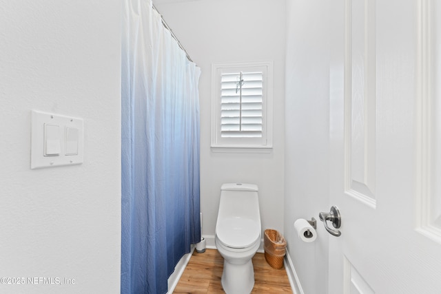 1317 Garrison Dr, Saint Augustine, FL 32092 - bathroom with wood finished floors and a shower with curtain