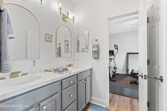 1317 Garrison Dr, Saint Augustine, FL 32092 - full bathroom with double vanity and wood finished floors