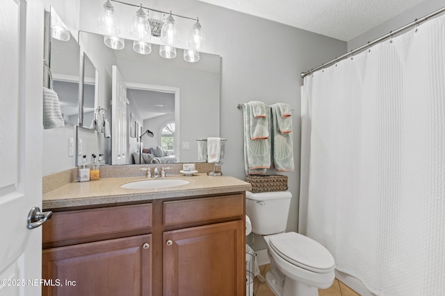1317 Garrison Dr, Saint Augustine, FL 32092 - ensuite bathroom with vanity, tile patterned flooring, a shower with curtain, and a textured ceiling