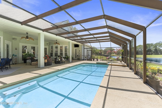 1317 Garrison Dr, Saint Augustine, FL 32092 - view of swimming pool featuring a patio area, a ceiling fan, a pool with connected hot tub, and a lanai