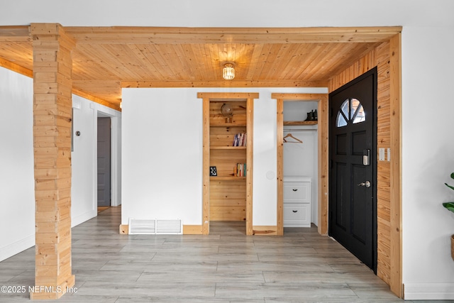 479 Tara Ln, Orange Park, FL 32073 - entryway featuring wood ceiling, light wood-style flooring, and wooden walls