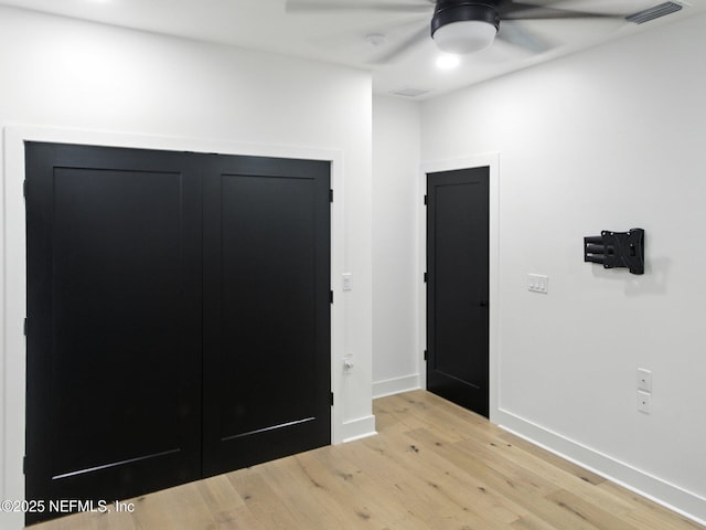 432 SE 55th St, Keystone Heights, FL 32656 - unfurnished bedroom with light wood-style flooring and ceiling fan