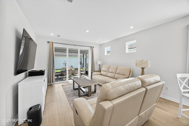322 Fairlake Cir, Saint Augustine, FL 32092 - living room featuring light wood-type flooring and recessed lighting