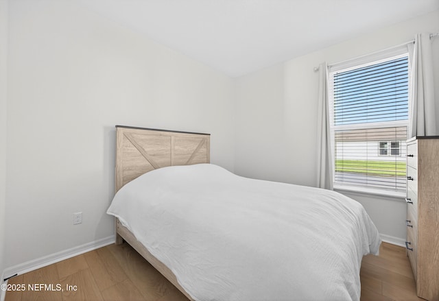 322 Fairlake Cir, Saint Augustine, FL 32092 - bedroom featuring wood finished floors and baseboards