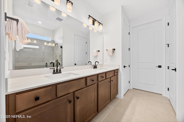 322 Fairlake Cir, Saint Augustine, FL 32092 - bathroom featuring double vanity, a stall shower, and tile patterned flooring