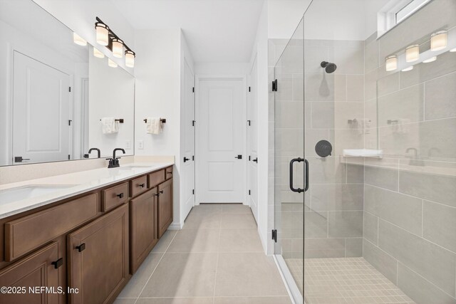 322 Fairlake Cir, Saint Augustine, FL 32092 - bathroom featuring double vanity, tile patterned flooring, and a shower stall