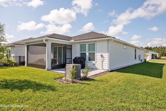 322 Fairlake Cir, Saint Augustine, FL 32092 - rear view of house featuring a sunroom and roof with shingles