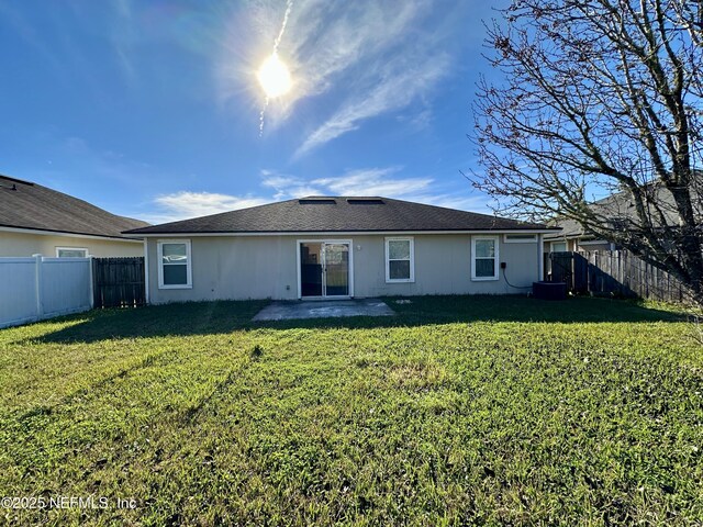 45575 Ingleham Cir, Callahan, FL 32011 - rear view of property with a fenced backyard