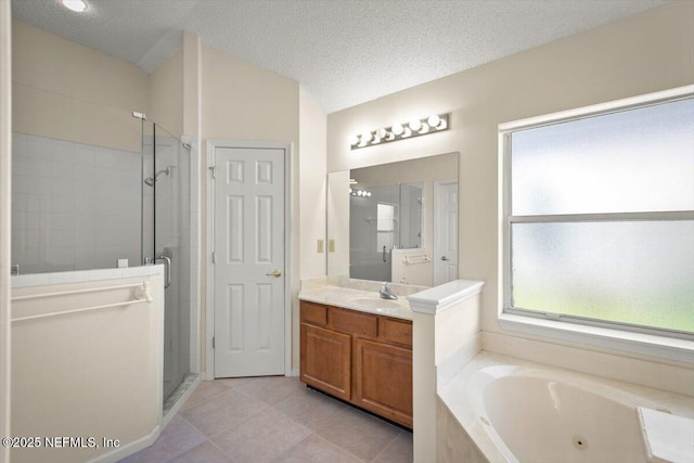 1385 Soaring Flight Way, Jacksonville, FL 32225 - full bath with a shower stall, vanity, a tub with jets, tile patterned flooring, and a textured ceiling