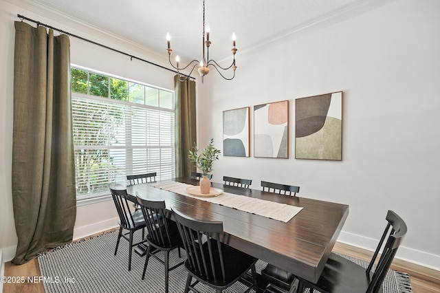 4342 Richmond Park Dr E, Jacksonville, FL 32224 - dining area featuring a chandelier, plenty of natural light, wood finished floors, and crown molding