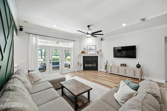 4342 Richmond Park Dr E, Jacksonville, FL 32224 - living area with ceiling fan, wood finished floors, crown molding, french doors, and recessed lighting