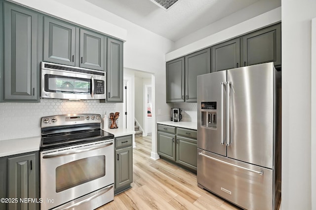 4342 Richmond Park Dr E, Jacksonville, FL 32224 - kitchen featuring appliances with stainless steel finishes, backsplash, and light countertops