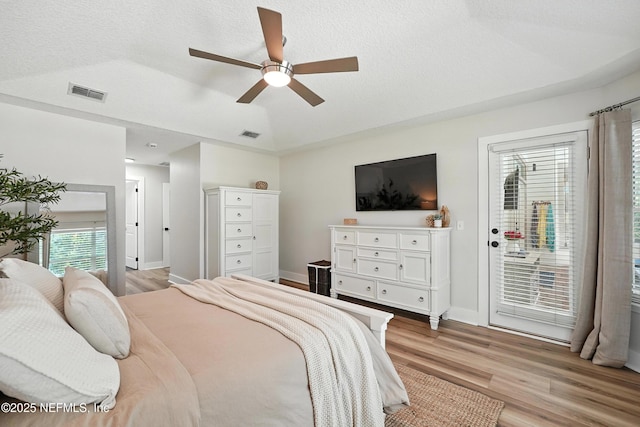 4342 Richmond Park Dr E, Jacksonville, FL 32224 - bedroom with light wood-style floors, a textured ceiling, ceiling fan, and lofted ceiling