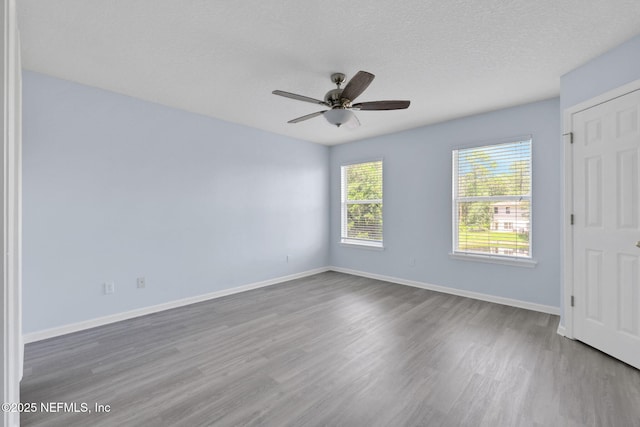 212 Northbridge Ct, Saint Johns, FL 32259 - unfurnished bedroom featuring wood finished floors, ceiling fan, and a textured ceiling