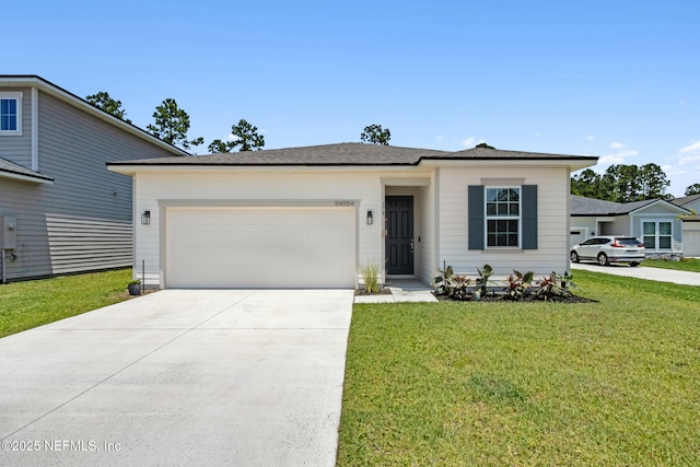 94954 Colnago Ct, Fernandina Beach, FL 32034 - view of front of house featuring concrete driveway, a garage, and a front lawn