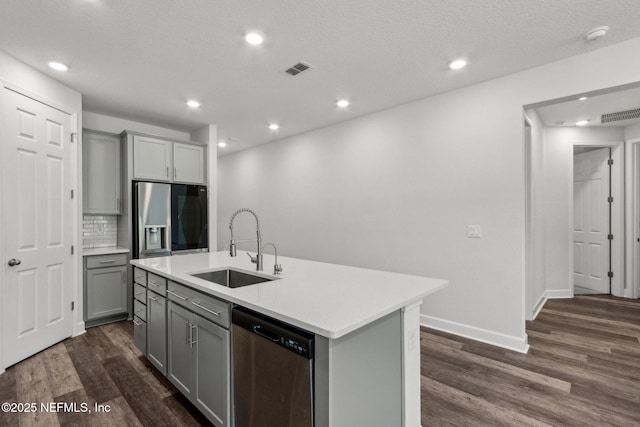 94954 Colnago Ct, Fernandina Beach, FL 32034 - kitchen with appliances with stainless steel finishes, gray cabinets, dark wood-style flooring, light countertops, and recessed lighting