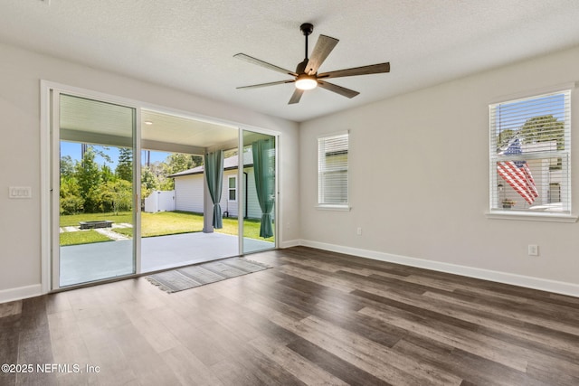 94954 Colnago Ct, Fernandina Beach, FL 32034 - unfurnished room with a ceiling fan, wood finished floors, and a textured ceiling