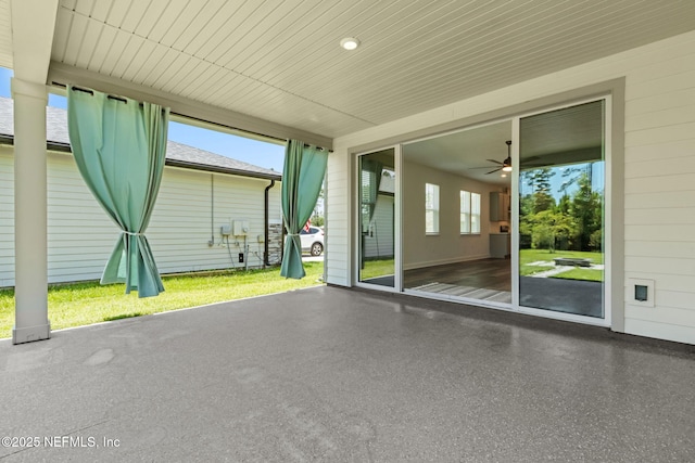 94954 Colnago Ct, Fernandina Beach, FL 32034 - unfurnished sunroom featuring a ceiling fan