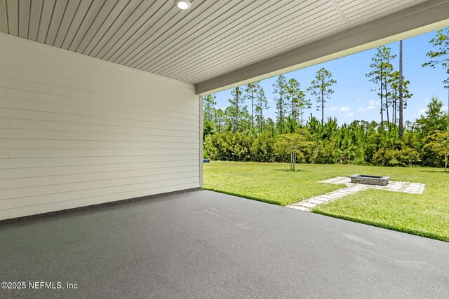 94954 Colnago Ct, Fernandina Beach, FL 32034 - view of patio / terrace featuring an outdoor fire pit