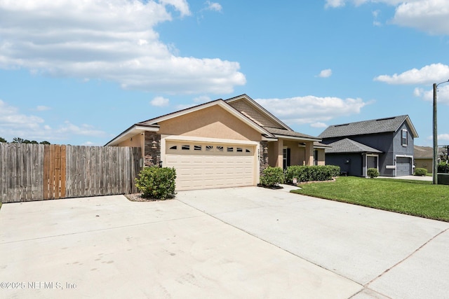 2947 Vianey Pl, Green Cove Springs, FL 32043 - ranch-style home featuring stucco siding, a garage, concrete driveway, and stone siding