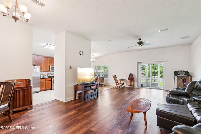 2947 Vianey Pl, Green Cove Springs, FL 32043 - living area featuring a chandelier, wood finished floors, a ceiling fan, a textured ceiling, and lofted ceiling