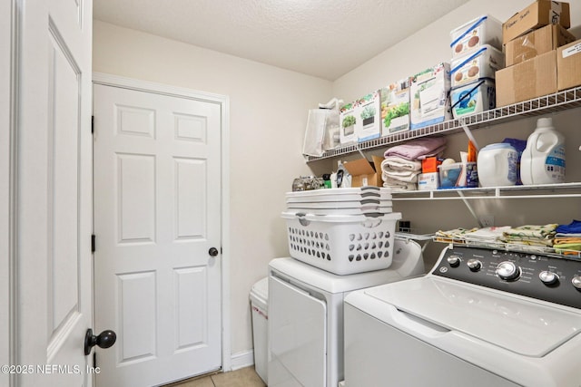 2947 Vianey Pl, Green Cove Springs, FL 32043 - laundry room featuring washer and dryer, light tile patterned floors, and a textured ceiling