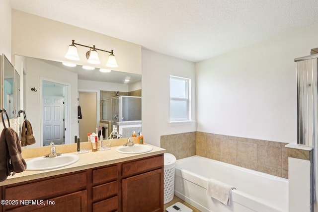 2947 Vianey Pl, Green Cove Springs, FL 32043 - bathroom with a stall shower, a garden tub, double vanity, and a textured ceiling