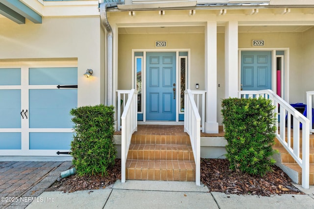 308 High Tide Dr Unit 201, Saint Augustine, FL 32080 - view of exterior entry with stucco siding