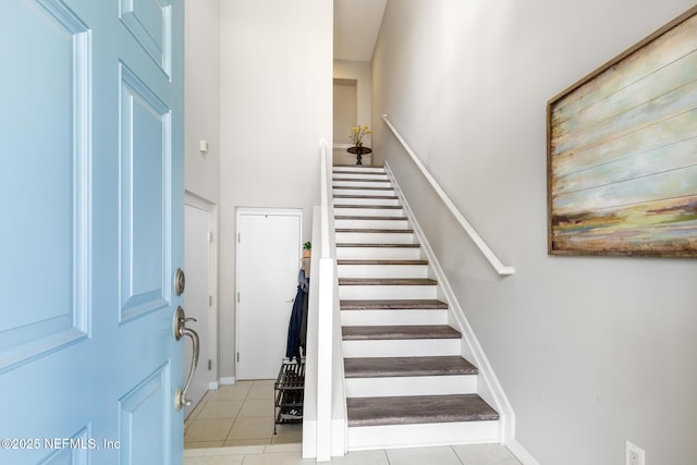 308 High Tide Dr Unit 201, Saint Augustine, FL 32080 - staircase featuring tile patterned flooring
