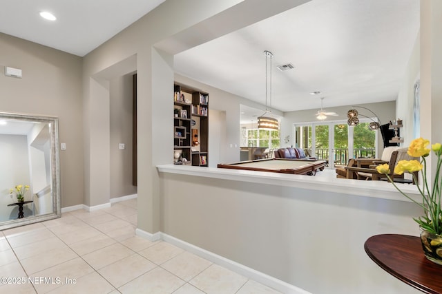 308 High Tide Dr Unit 201, Saint Augustine, FL 32080 - kitchen with tile patterned floors, hanging light fixtures, recessed lighting, and light countertops