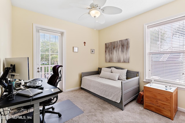 308 High Tide Dr Unit 201, Saint Augustine, FL 32080 - bedroom featuring light carpet, a desk, access to outside, and a ceiling fan