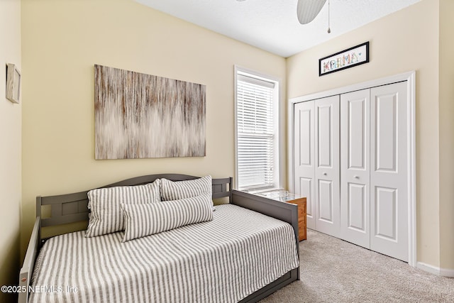 308 High Tide Dr Unit 201, Saint Augustine, FL 32080 - bedroom featuring carpet flooring, multiple windows, a closet, and ceiling fan