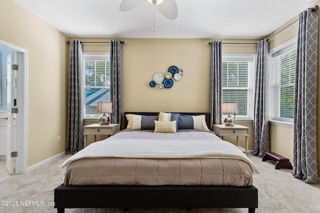 308 High Tide Dr Unit 201, Saint Augustine, FL 32080 - carpeted bedroom featuring multiple windows and ceiling fan