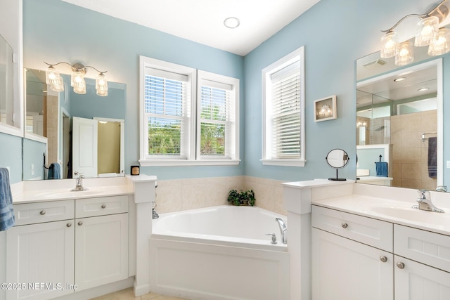 308 High Tide Dr Unit 201, Saint Augustine, FL 32080 - bathroom with a bath, two vanities, and tiled shower