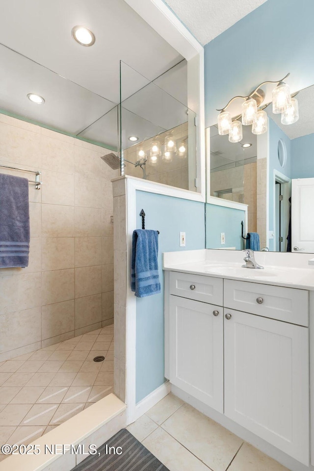 308 High Tide Dr Unit 201, Saint Augustine, FL 32080 - bathroom with vanity, walk in shower, and tile patterned floors