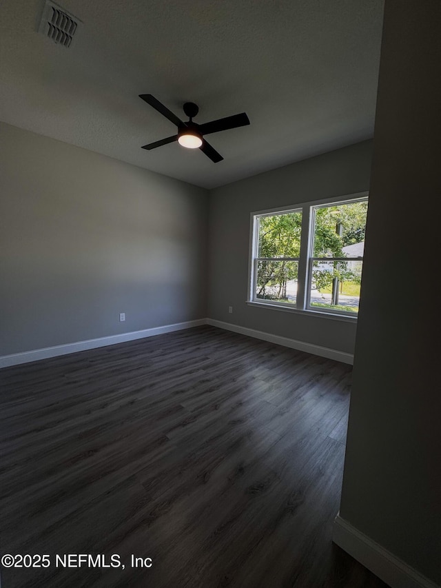 5408 Potomac Ave, Jacksonville, FL 32254 - spare room featuring dark wood finished floors and ceiling fan