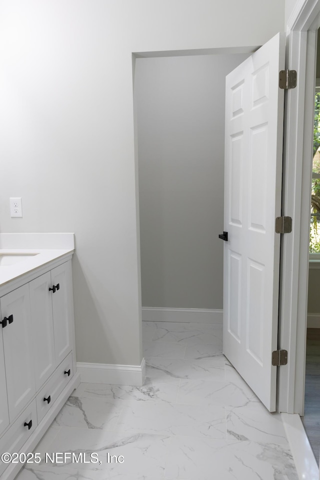 5408 Potomac Ave, Jacksonville, FL 32254 - bathroom featuring marble look tiles and vanity