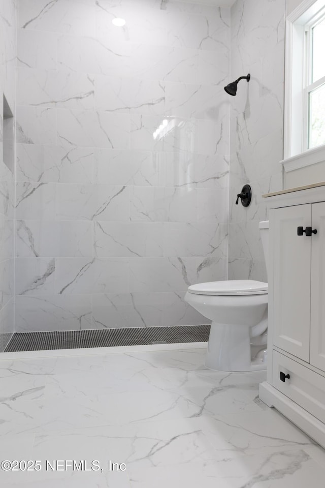 5408 Potomac Ave, Jacksonville, FL 32254 - bathroom with a marble finish shower, marble finish floors, and vanity