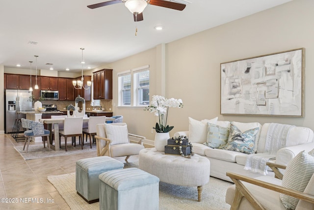 48 Gilchrist Way, Saint Johns, FL 32092 - living room with recessed lighting, a ceiling fan, light tile patterned floors, and a chandelier