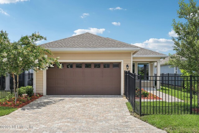 48 Gilchrist Way, Saint Johns, FL 32092 - ranch-style house featuring a garage, decorative driveway, and roof with shingles