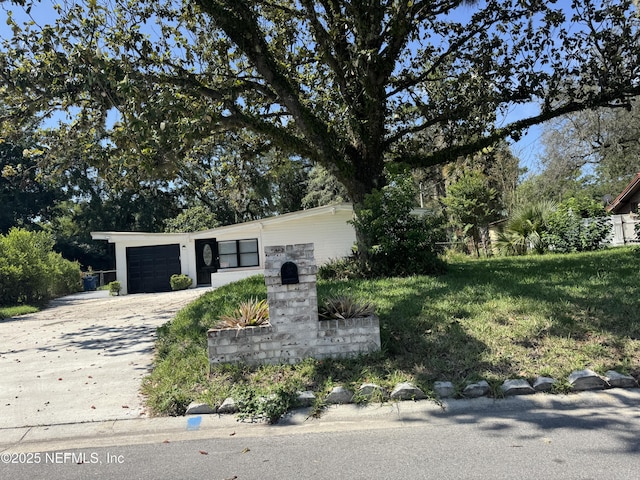 7942 Helston Dr, Jacksonville, FL 32208 - view of front of property with a garage and driveway