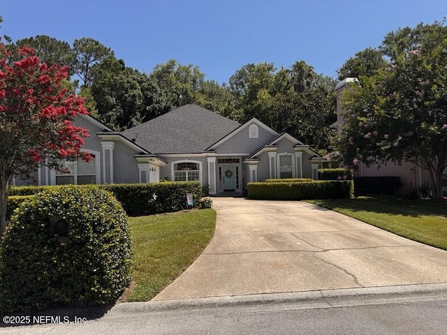 121 Bouganvilla Dr, Ponte Vedra Beach, FL 32082 - view of front of house with a front lawn and concrete driveway