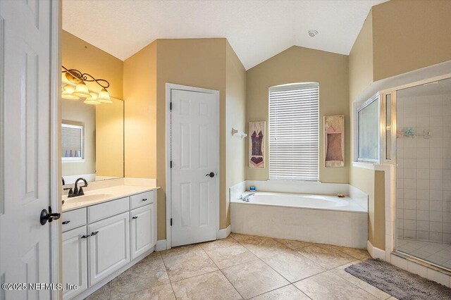 121 Bouganvilla Dr, Ponte Vedra Beach, FL 32082 - bathroom with a bath, vanity, a stall shower, vaulted ceiling, and tile patterned floors