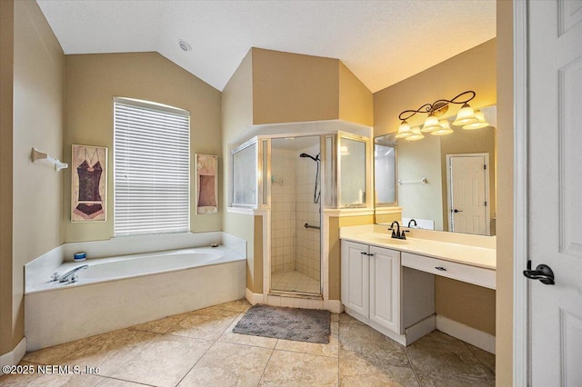 121 Bouganvilla Dr, Ponte Vedra Beach, FL 32082 - bathroom with vaulted ceiling, vanity, a garden tub, a stall shower, and plenty of natural light