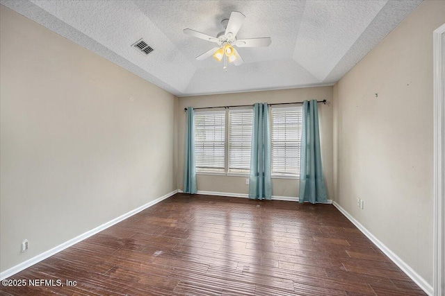 121 Bouganvilla Dr, Ponte Vedra Beach, FL 32082 - empty room with ceiling fan, a textured ceiling, wood finished floors, and a tray ceiling
