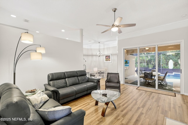 8523 Hampton Landing Dr, Jacksonville, FL 32256 - living area featuring a ceiling fan, crown molding, light wood-style floors, and recessed lighting