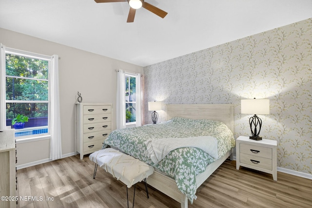 8523 Hampton Landing Dr, Jacksonville, FL 32256 - bedroom featuring wallpapered walls, wood finished floors, and a ceiling fan