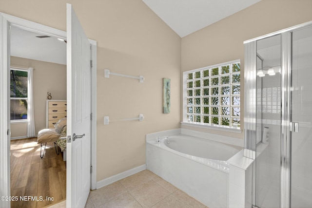 8523 Hampton Landing Dr, Jacksonville, FL 32256 - full bath with a bath, healthy amount of natural light, a shower stall, and lofted ceiling